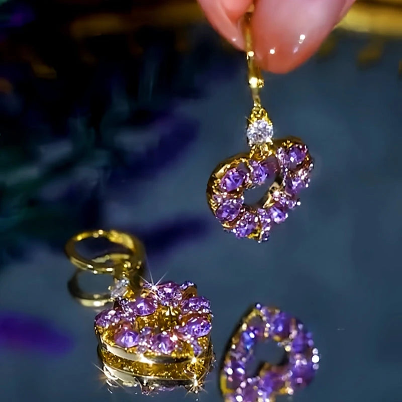 Angled view of the 14K Gold-Plated Elegant Purple Zircon Heart Earrings