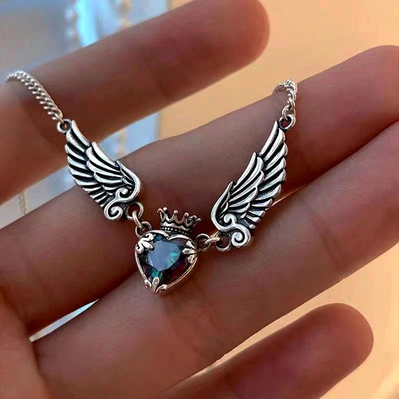 Diamond Heart Crown Angel Wing Necklace worn to showcase its length and pendant detail
