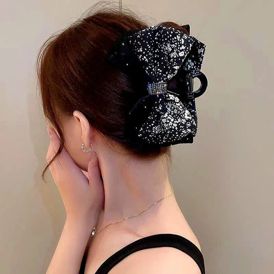 Angled view of the stylish Elegant Bow Floral Hair Clips