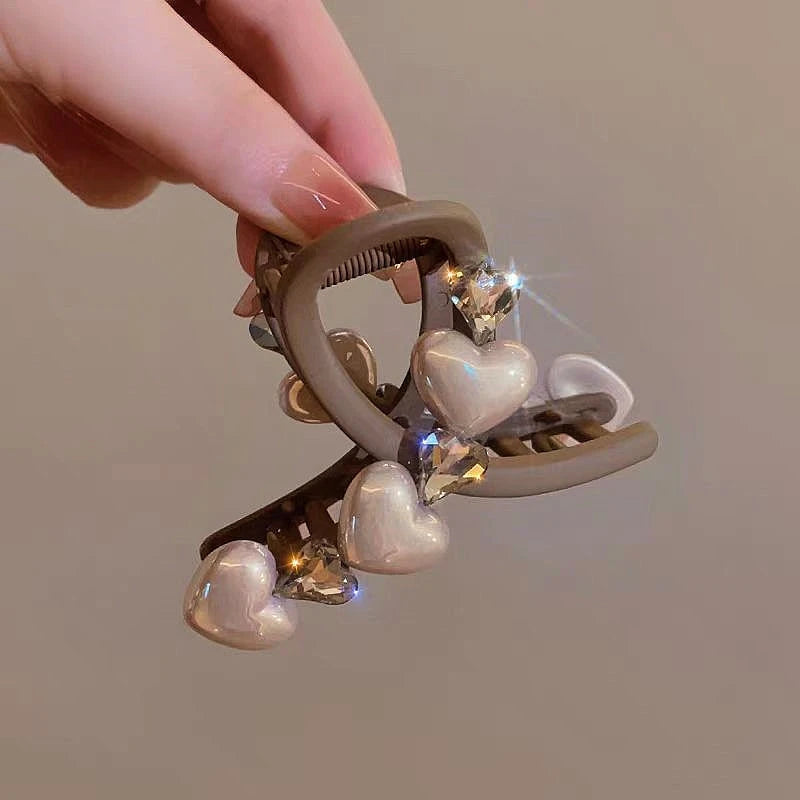 Elegant Brown Pearl Rhinestone Hair Clips shown for scale and size reference