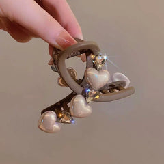 Elegant Brown Pearl Rhinestone Hair Clips shown for scale and size reference