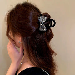 Angled view of the stylish Elegant Diamond Bow Hair Clip