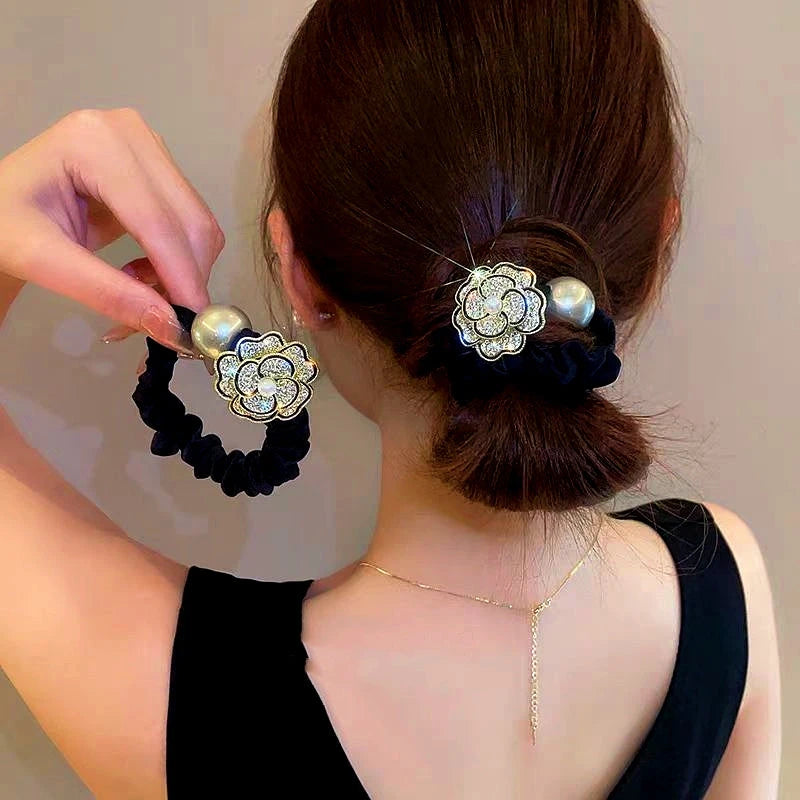 Angled view of the stylish Elegant Diamond Camellia Hair band