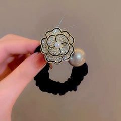 Close-up showing the material and craftsmanship of the Camellia Hair Band