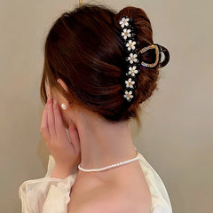 Close-up showing the material and craftsmanship of the Diamond Flower Hair Clips