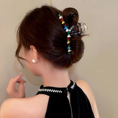 Angled view of the stylish Elegant Dopamine Colored Love Acrylic Hair Clip