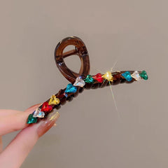 Elegant Dopamine Colored Love Acrylic Hair Clip shown for scale and size reference