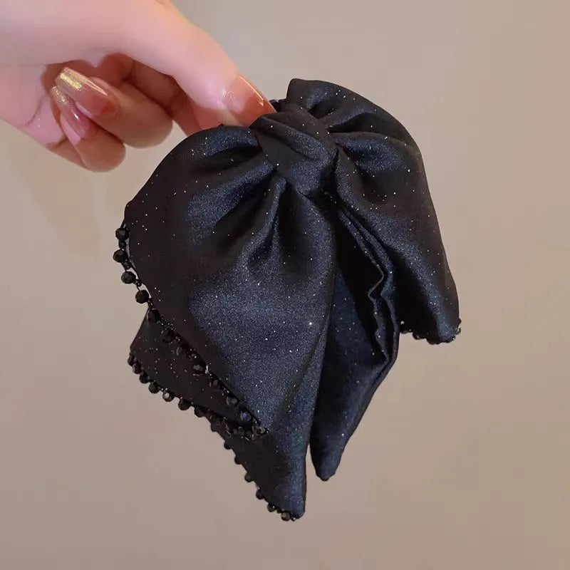 The versatile Elegant Starlight Streamer Bow Hair Band, perfect for daily use or special occasions