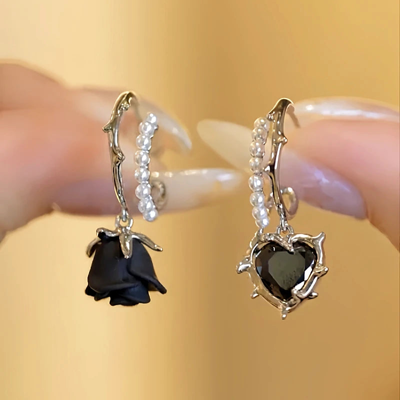 Angled view of the Halloween 14K Gold-Plated Black Flower And Heart Earrings