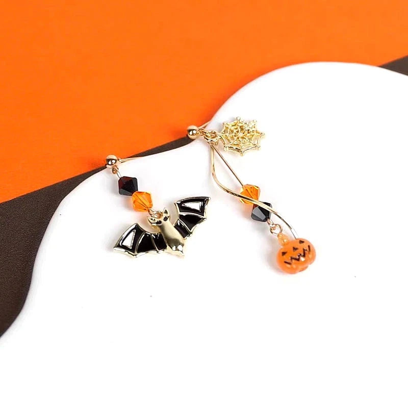 Close-up detail of the sparkling zircons and plating on the Pumpkin Bat Earrings