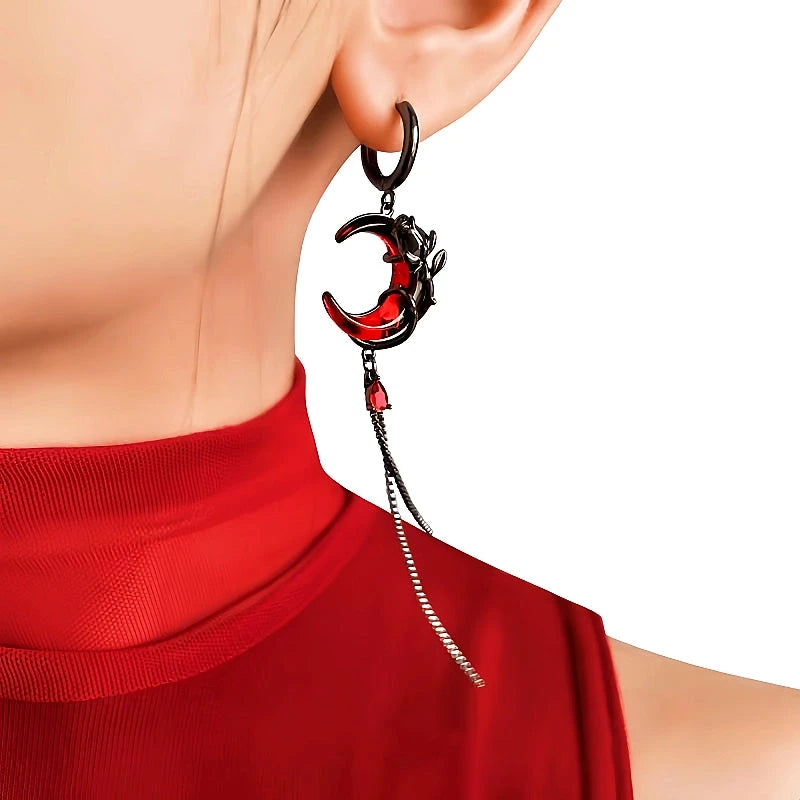 Model showcasing the dangle and style of the Halloween 14K Gold-Plated Red Crescent Asymmetrical Earrings