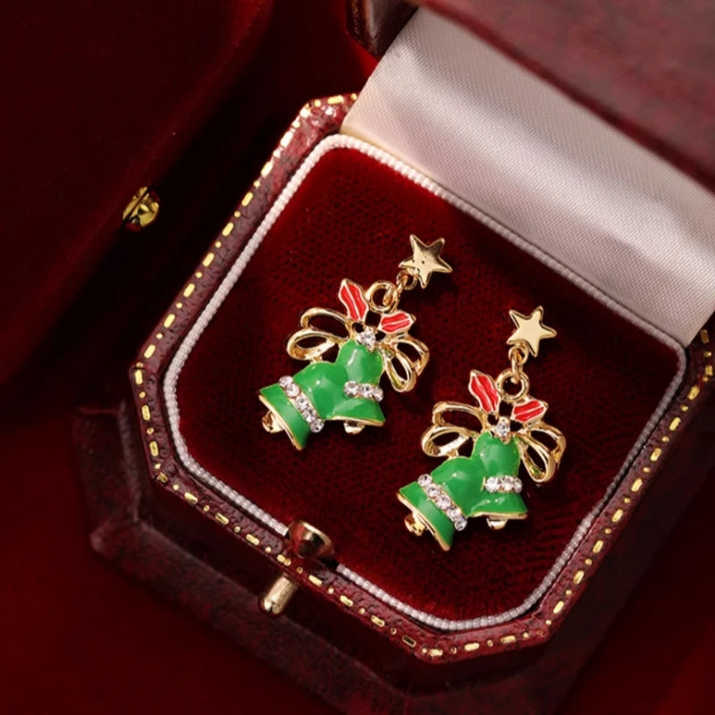 Angled view of the Silver Post Christmas Bow Bell Earrings