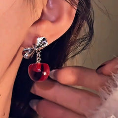 Close-up detail of the sparkling zircons and plating on the Christmas Bow Earrings