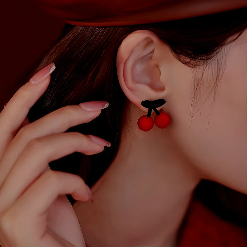 Close-up detail of the sparkling zircons and plating on the Christmas Cherry Earrings