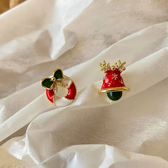 Model showcasing the dangle and style of the Silver Post Christmas Santa Claus Bell Earrings