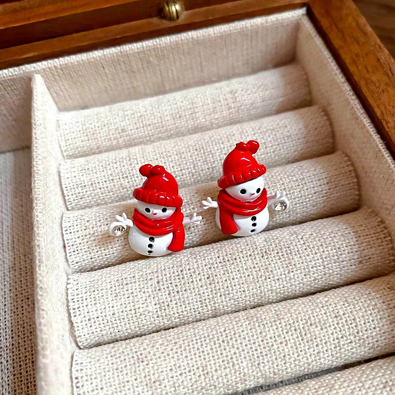 Angled view of the Silver Post Christmas Scarf Snowman Stud Earrings