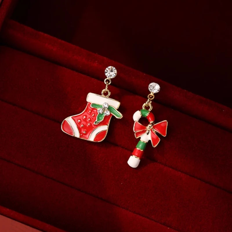 Angled view of the Silver Post Christmas Stockings Cane Asymmetrical Earrings