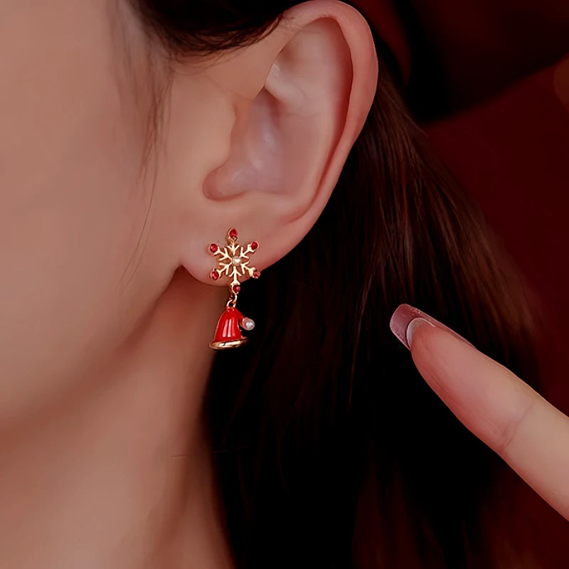 Model showcasing the dangle and style of the Silver Post Christmas Tree Hat Asymmetrical Earrings