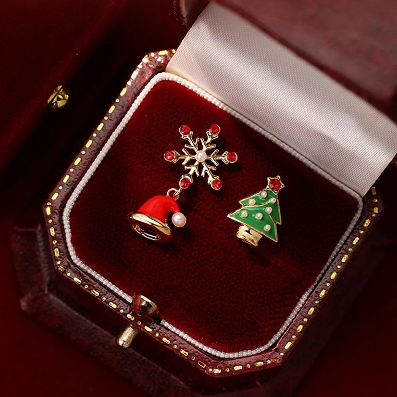 Angled view of the Silver Post Christmas Tree Hat Asymmetrical Earrings