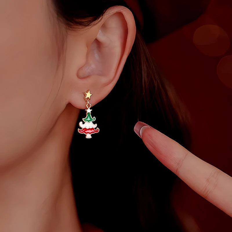 Model showcasing the dangle and style of the Silver Post Christmas Tree Wreath Asymmetrical Earrings