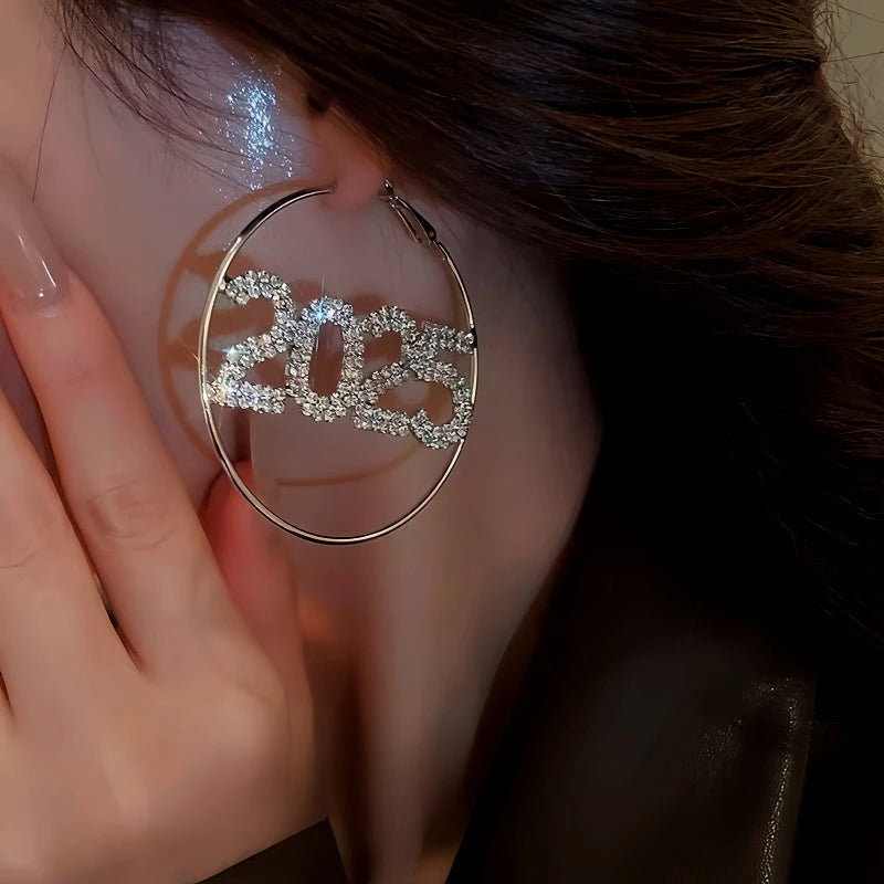 Model showcasing the dangle and style of the Silver Post Diamond 2025 New Year Hoop Earrings