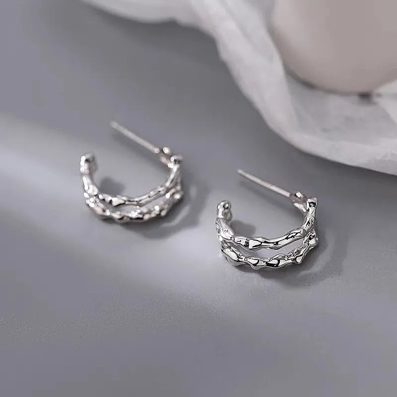 Close-up detail of the sparkling zircons and plating on the Double Layer Hoops