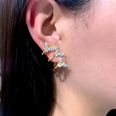 Model showcasing the dangle and style of the Silver Post Elegant Rhinestone Butterfly Stud Earrings