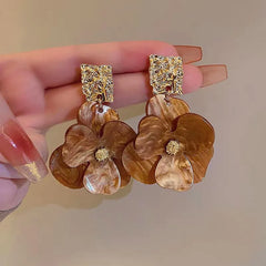 Angled view of the Silver Post Flower Earrings