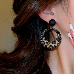 Close-up detail of the sparkling zircons and plating on the Leopard Hoop Earrings