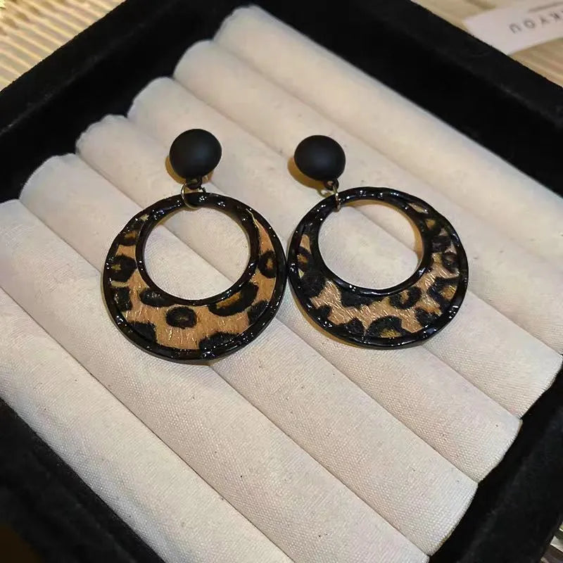 Angled view of the Silver Post Leopard Hoop Earrings