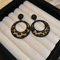 Angled view of the Silver Post Leopard Hoop Earrings
