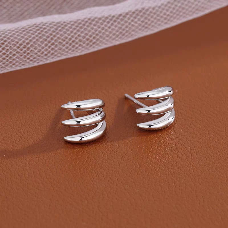 Angled view of the Silver Post Multi-Layer Claw Studs