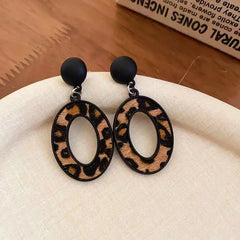 Angled view of the Silver Post Oval Leopard Print Earrings