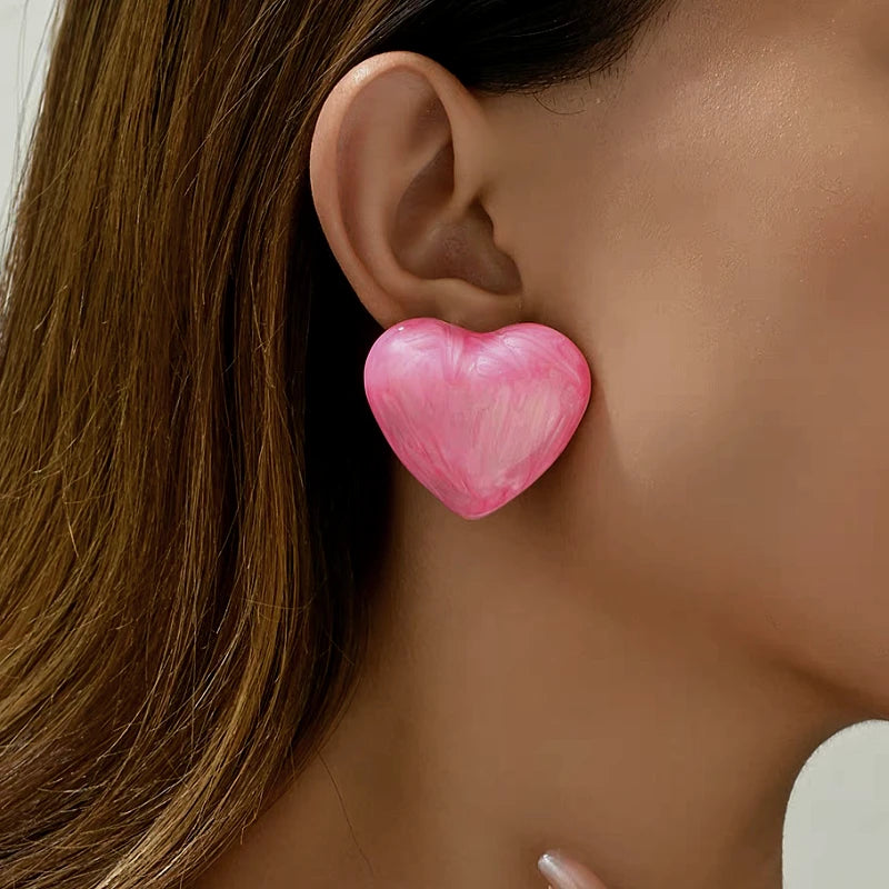Styling the Painted Heart Studs for a chic and modern look