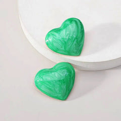 Close-up detail of the sparkling zircons and plating on the Painted Heart Studs