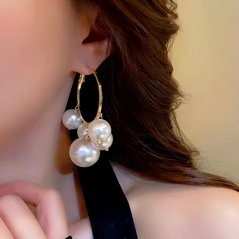 Close-up detail of the sparkling zircons and plating on the Pearl Tassel Hoops