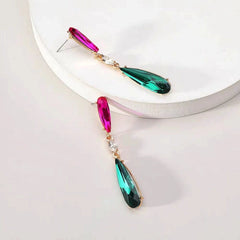 Model showcasing the dangle and style of the Silver Post Rhinestonen Water Drop Earrings