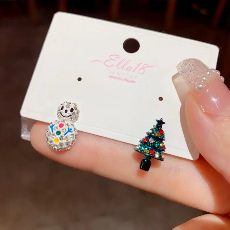 Angled view of the Silver Post Snowman Christmas Tree Snowflake Earrings