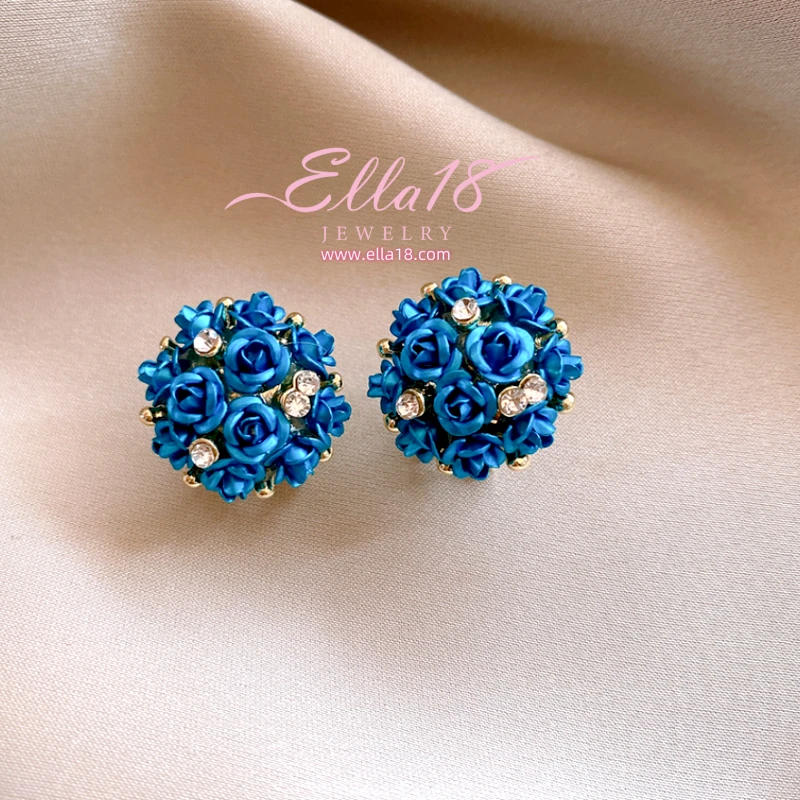 Angled view of the Silver Post Zircon Diamond Flower Stud Earrings