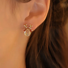 Close-up detail of the sparkling zircons and plating on the Elk Snowflake Earrings