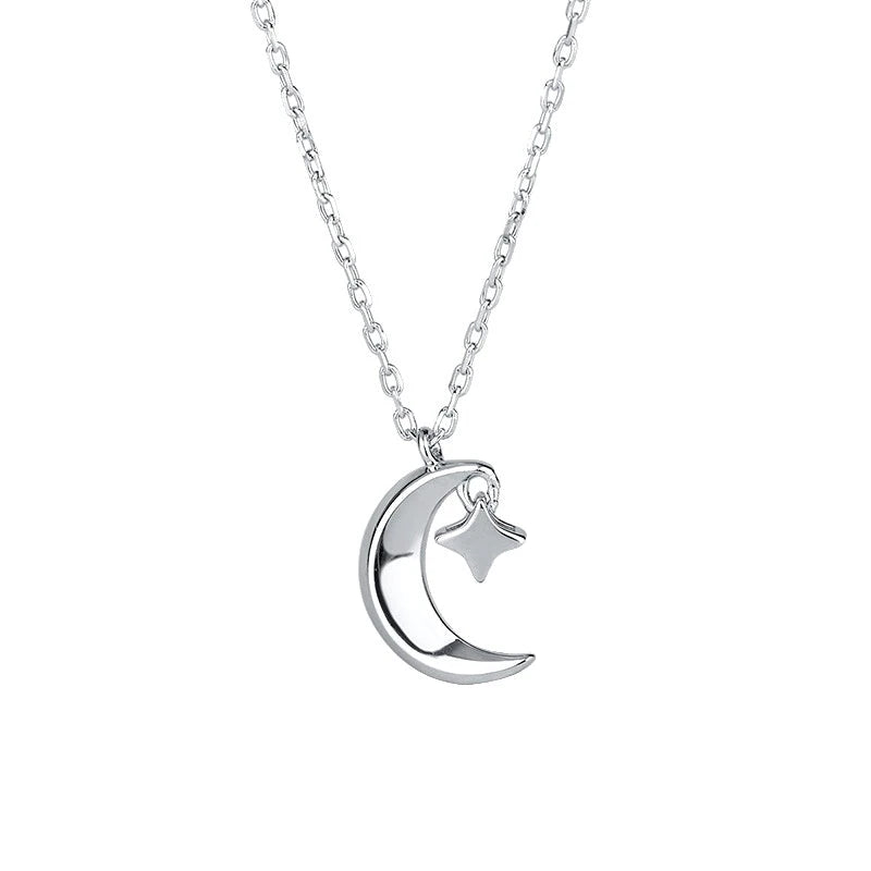 Close-up of the pendant and clasp on the Star and Moon Necklace