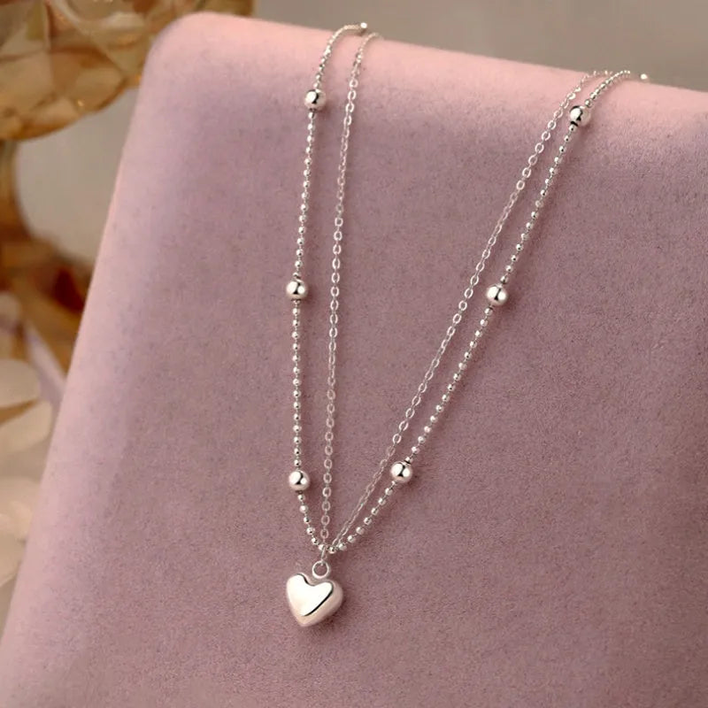 Detailed view of the Sterling Silver 2025 Double-Layer Love Heart Necklace chain and pendant