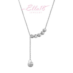 Close-up of the pendant and clasp on the Beads Tassel Necklace