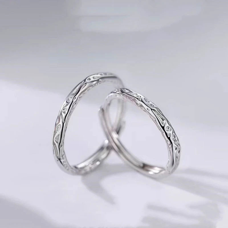 Sterling Silver Adjustable Candy Paper Couple Rings worn on the hand to show its beautiful fit and design