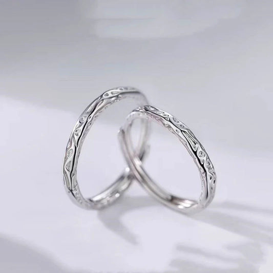 Sterling Silver Adjustable Candy Paper Couple Rings worn on the hand to show its beautiful fit and design