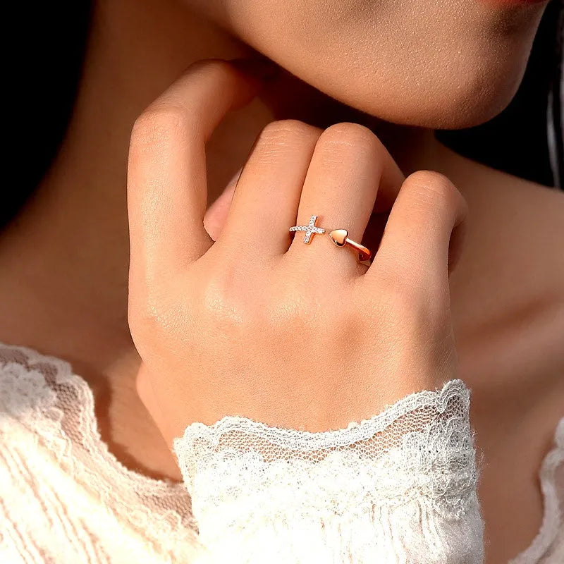 Sterling Silver Adjustable Cross Love Heart Rings worn on the hand to show its beautiful fit and design