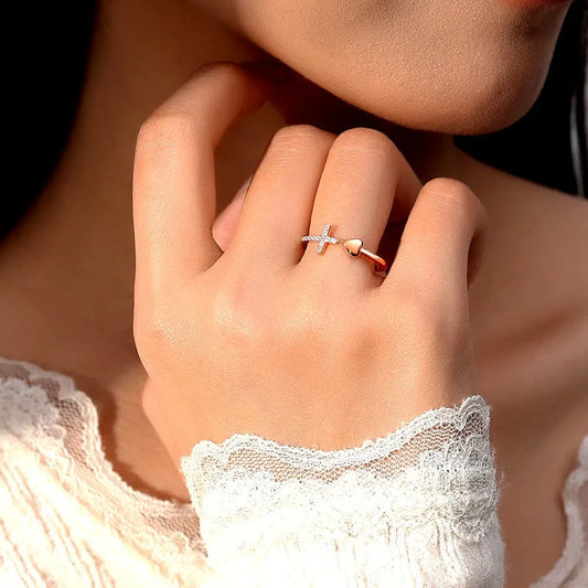Sterling Silver Adjustable Cross Love Heart Rings worn on the hand to show its beautiful fit and design