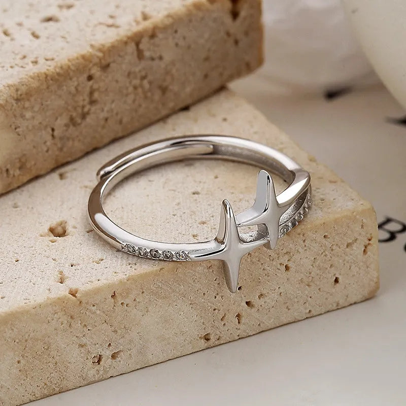 Sterling Silver Adjustable Cross Star Diamond Rings worn on the hand to show its beautiful fit and design