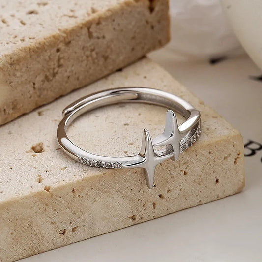 Sterling Silver Adjustable Cross Star Diamond Rings worn on the hand to show its beautiful fit and design