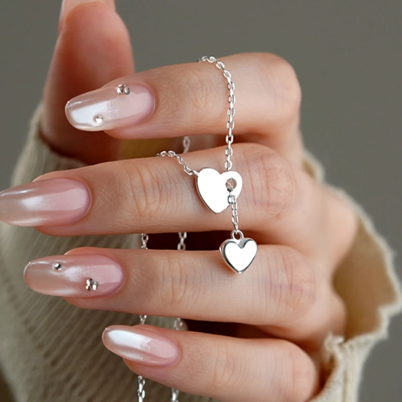 Detailed view of the Sterling Silver Adjustable Heart Necklace chain and pendant